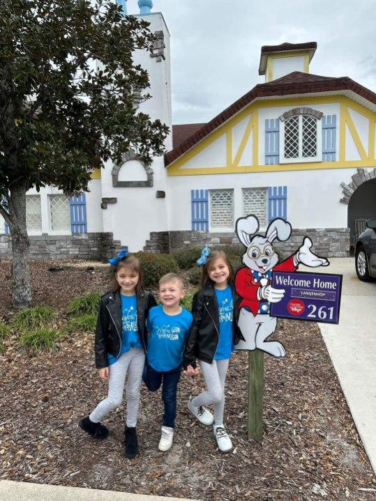 Landon and Sisters in Front of GKTW Villa with Wishes Shirts