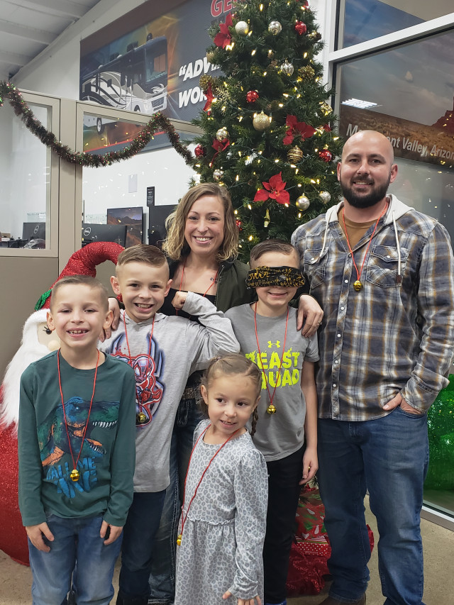 Xavier Blindfolded Family at Christmas Tree